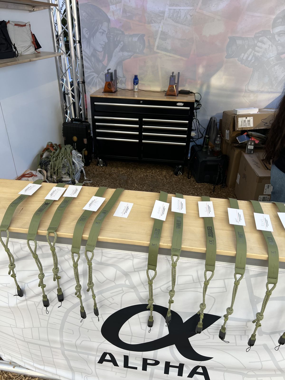 Personalized gift straps laid out on a table with printed name cards awaiting pickup